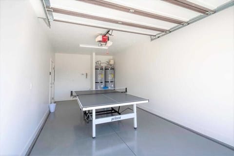 Enjoy ping pong in garage that folds up for parking