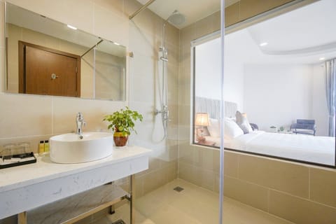 Combined shower/tub, designer toiletries, hair dryer, bathrobes