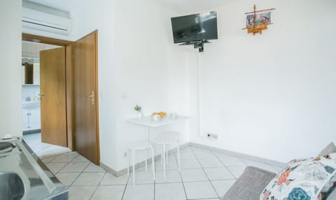 Basic Apartment | Living area | 32-inch LCD TV with satellite channels, TV