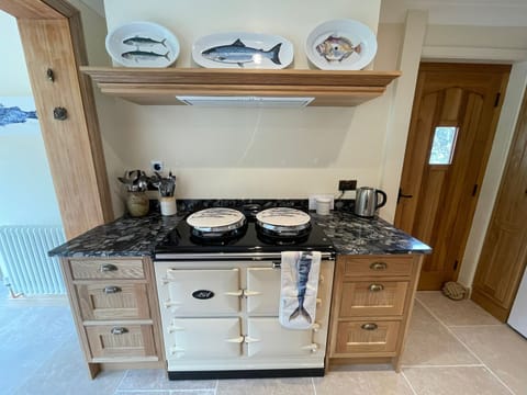 New handmade oak kitchen, granite worktops, electric oven and electric Aga.
