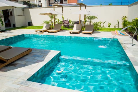 Outdoor pool, open 8:00 AM to 10:00 PM, sun loungers