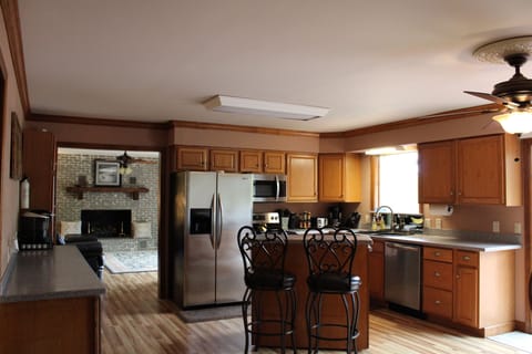 Kitchen with island and barstools.