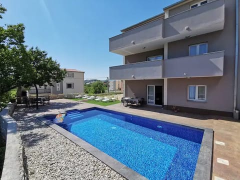 House (Six Bedroom holiday home with Swimmin) | Pool | Seasonal outdoor pool, pool umbrellas, sun loungers