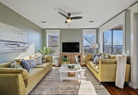 Family room with couch that makes into a queen bed and 65" screen 