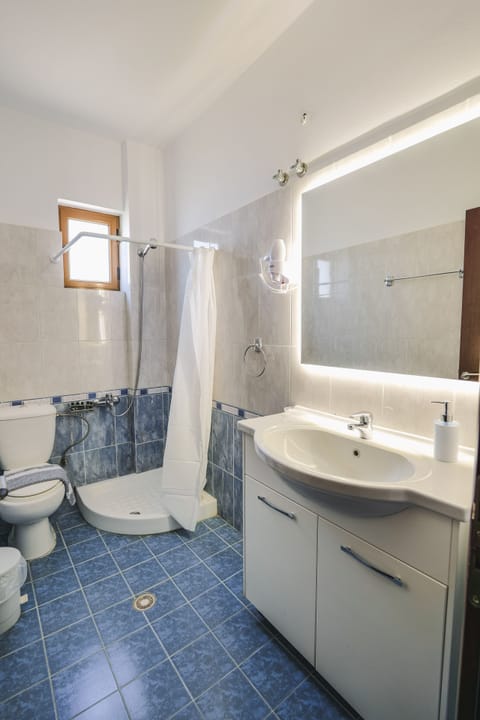Two Bedroom Suite | Bathroom | Shower, rainfall showerhead, hair dryer, slippers