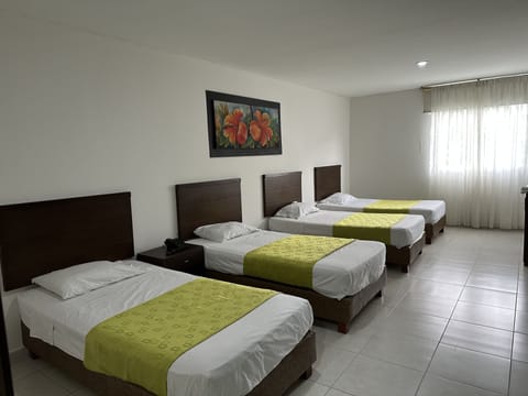 Basic Triple Room, Multiple Beds | Minibar, desk, laptop workspace, free WiFi