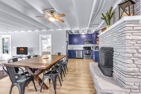 Large stone fireplace and dining area