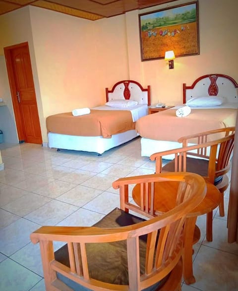 Deluxe Twin Room, 2 Twin Beds, Pool View | Minibar, in-room safe, individually decorated, desk