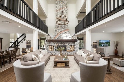 Grand Entrance. Towering Stone Log Fireplace