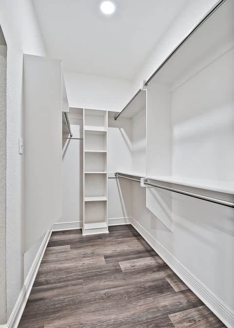 Closet in Main Bedroom that connects to laundry room