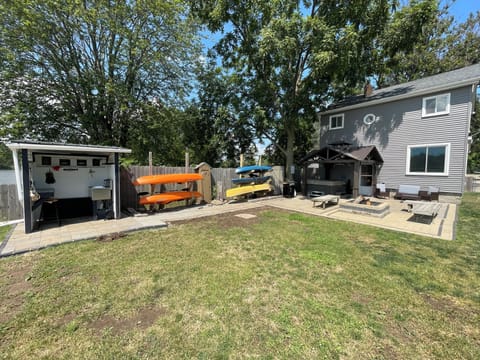 Back yard/patio. Fish cleaning shed. Fire pit. 4 kayaks and one canoe for use.