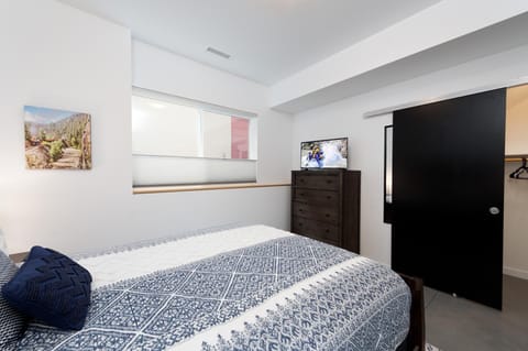 Durango, CO Vacation Rental Townhome - Bedroom with queen size bed, tv, clothes dresser, closet