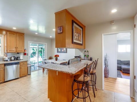 bar area with 2 stools for additional dining area.