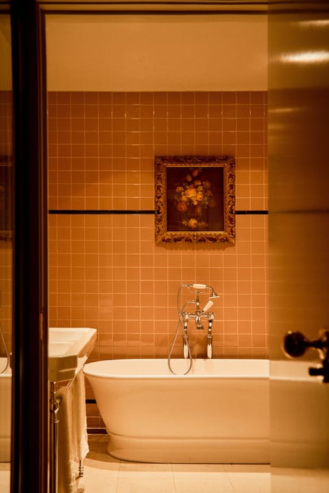 Grand Suite (Norfolk) | Bathroom | Designer toiletries, hair dryer, slippers, towels