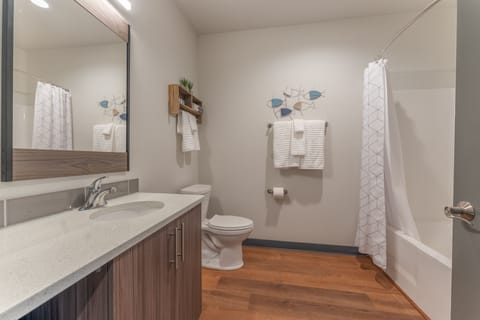 Deluxe Room, 2 Queen Beds | Bathroom | Rainfall showerhead, hair dryer, towels