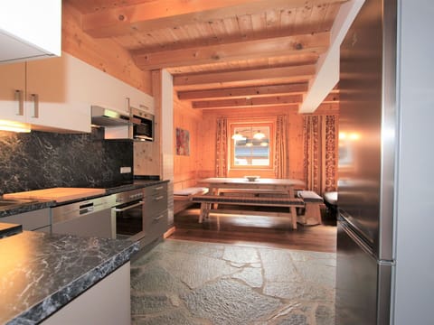 Furniture, Cabinetry, Countertop, Building, Wood, Kitchen Stove, Interior Design, Flooring, Hall, Floor