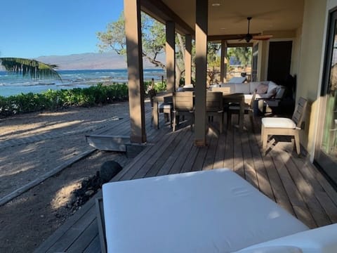 The lanai with bar area and comfortable seating and dining.