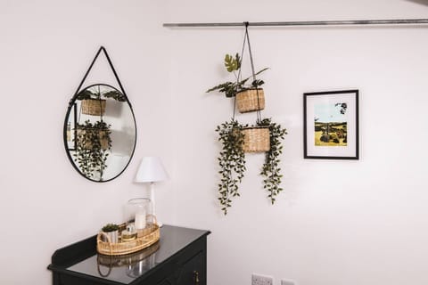 Hanging baskets on the wall at Luxury Penthouse, Cotswolds