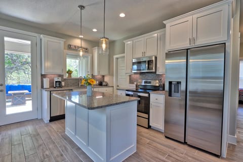 Full kitchen with stainless steel appliances