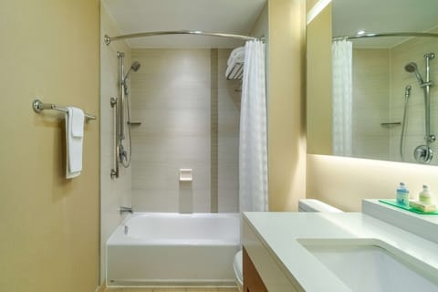 Combined shower/tub, designer toiletries, hair dryer, towels