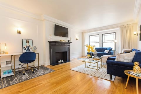 Welcome to our 2bd/2ba in Gold Coast, a block from Mag Mile! Wifi here is up to 500 MBPS.Pictured here is our living room with a desk, 50” Smart TV, Chaise, and gilded decor