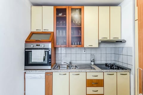 Comfort Apartment | Private kitchen | Full-size fridge, microwave, oven, stovetop