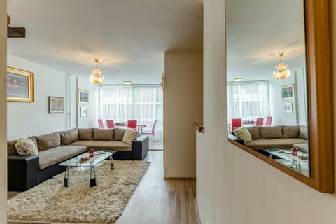 Comfort Apartment | Living area | 55-inch LCD TV with cable channels, TV