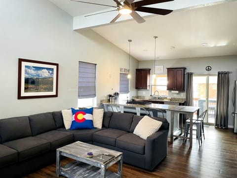 Living room, indoor dining, kitchen, walkout balcony