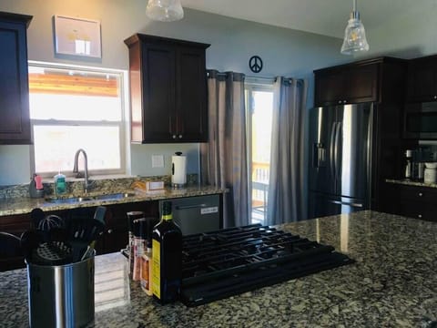 well equipped kitchen with spices and oils