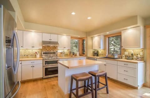 The generous kitchen offers butcher block counter tops