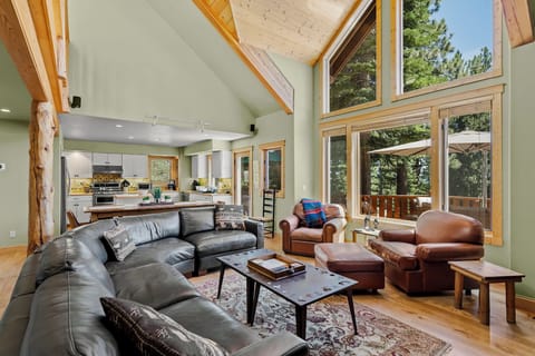Alternate view of the great room-floor to ceiling windows face the lake and deck