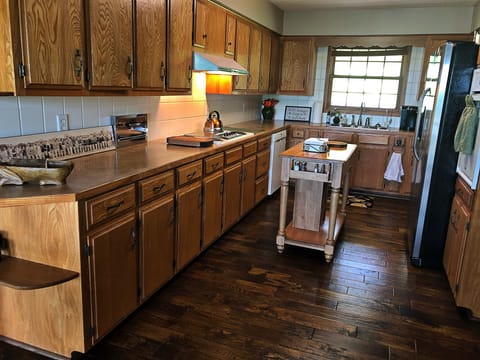 Spacious galley kitchen has been updated but still has mid-century charm.