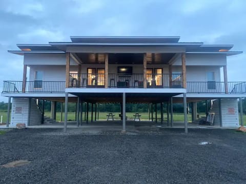 Exterior of OTR 
Both sets of double doors have riverview front porch 