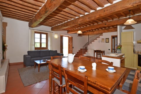 The living room with dining area and kitchen corner in the apartmnent 1
