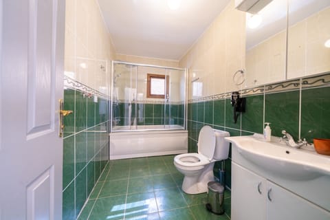 Family Apartment | Bathroom | Shower, rainfall showerhead, hair dryer, soap