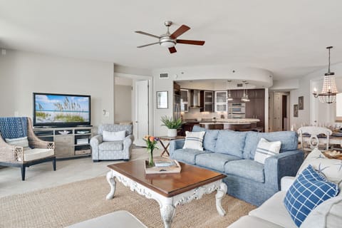 A light-filled living space with captivating views. This inviting room offers a perfect blend of comfort and style, creating a welcoming atmosphere for all.