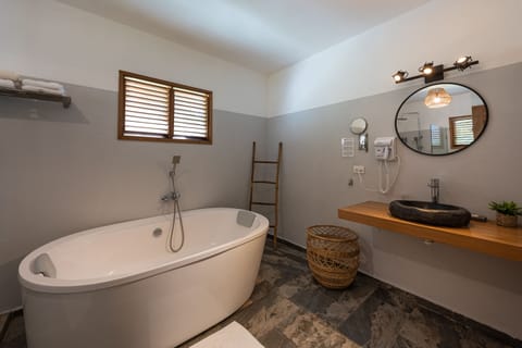 Exclusive Double Room, Bathtub, Poolside | Bathroom | Hair dryer, towels, soap, shampoo