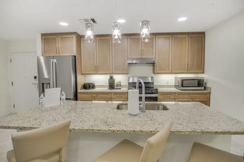 Deluxe Suite, 3 Bedrooms | Private kitchen | Full-size fridge, microwave, oven, stovetop