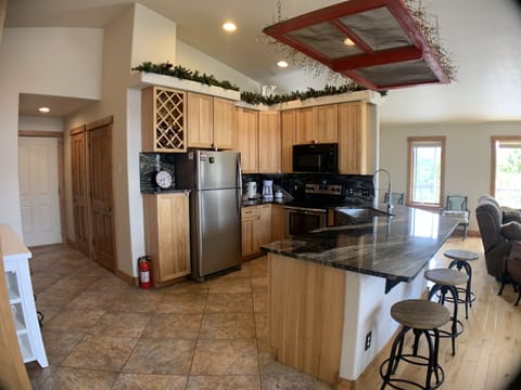 Kitchen area with bar stools