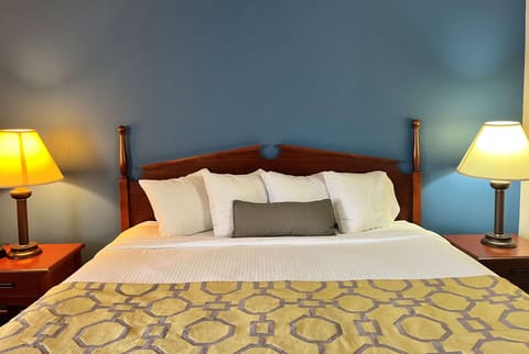 Desk, laptop workspace, blackout drapes, iron/ironing board