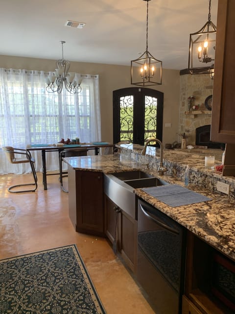 Cook meals in this beautiful kitchen w/views of the hill country.