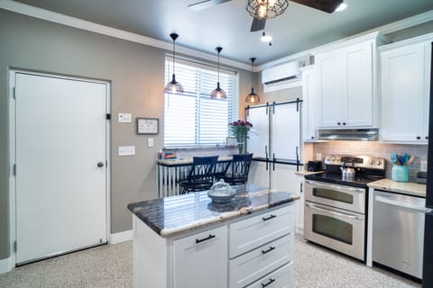Full Kitchen with double oven and a large window over the bar to see the sunset.