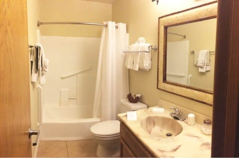 1 Bedroom, King Suite | Bathroom | Separate tub and shower, free toiletries, hair dryer, towels