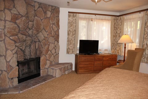 1 Bedroom, King Suite | Living area | TV, fireplace
