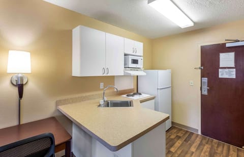 Studio, 1 King Bed, Non Smoking | Private kitchen | Fridge, microwave, stovetop