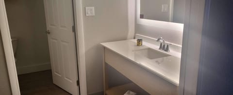 Suite, 1 King Bed, Non Smoking, Refrigerator & Microwave (Shower Only;Larger Room) | Bathroom | Combined shower/tub, eco-friendly toiletries, hair dryer, towels