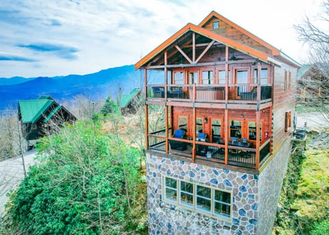 Enjoy spectacular mountain views from two large decks, firepit, comfy seating, hot tub and edison lights at night.