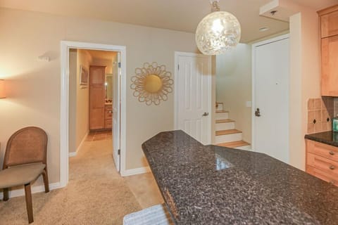 stairs to upper loft and door to main level bedroom