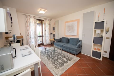 Family Apartment | Living area | 50-inch TV with cable channels