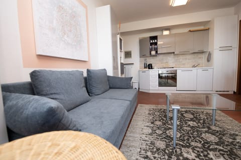 Family Apartment | Living area | 50-inch TV with cable channels